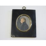 Finely painted portrait miniature of Georgian gentleman sideways on within an ebonised frame