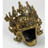 A 19th century brass and coloured hard stone incense burner, shaped as a head with a gaping mouth.
