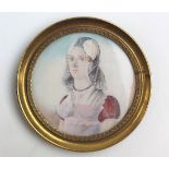 19th century french miniature of a lady in a bonnet mounted in a brass frame