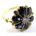 18ct/Plat ring with central Diamond surrounded by 6 oval Sapphires and small Diamonds size O