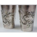 Chinese silver Tumblers with large dragon design, both marked 'WH90'. Weight 150 gms, approx 11cm