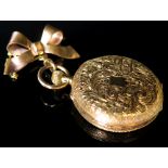 18ct Ladies open faced fob watch on a hanging bow with a safety chain,gold face with roman