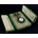 Cased Green Enamelled Ladies Silver Fob watch on a pin backed hanging bow some minor enamel chips