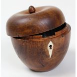 18th century apple shaped tea caddy shaped from fruitwood and lined in silver paper with an ivory