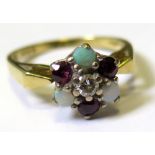 18ct Ring set with Opals and Garnets with central Diamond size O weight 5.2 grams