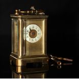 Miniature brass carriage clock stamped DH france complete with key