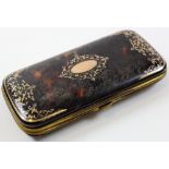 Tortoise shell cigar case with a gold floral pattern