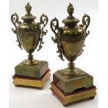 Pair of brass urns, each standing on velvet / gilt wooden bases, total height approx 27cm