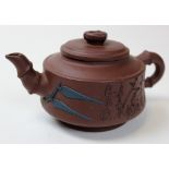 19th century Chinese Terracotta Yi-Xing Tea Pot decorated with bamboo leaves and text to the side.