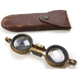 Pair of gilt brass Aitchison opera glasses, Patent number 24883. in original leather pouch