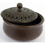 19th Century chinese bronze censer with pierced lid in a knotted design. Character marks to the