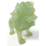 Chinese pale jade Dog of Fo carved in one piece and standing 7 cm long. Believed to be late 19th