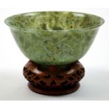 19th Century Chinese Spinich jade carved bowl on pierced carved fruitwood stand. Measures 10.5 cm