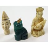 Two small 19th century carved ivory pieces together with a chinese dark jade pendant of a lucky cat