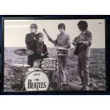 Music, a b/w Beatles poster showing them performing in a field circa 1965, this being a later print,