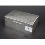 Silver rectangular cigarette box, the lid with engine turned decoration, width 5.5", Birmingham 1928