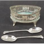 Edwardian silver salt of naivette form, pierced with ribbon swags, London 1908; together with a pair