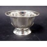 Edwardian silver pedestal bowl, gadrooned rim, the body fluted and shell scroll embossed, engraved