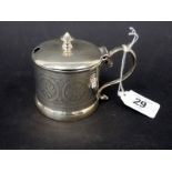 Victorian silver drum mustard, the hinged dome lid with finial, scroll handle, the body engraved