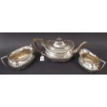 Edwardian silver three piece tea set of half fluted form, maker WS CS, London 1902, total weight