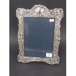 Modern Victorian style silver rectangular photograph frame, the shaped frame with embossed foliate