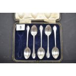 Silver five piece spoon set, cased; cased silver part manicure set and a cased silver spoon and