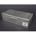 Silver rectangular cigarette box, with engine turned decoration and monogram, width 7.5", London