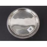 George IV silver card tray, with gadrooned rim, raised on triple foliate scroll and paw feet,