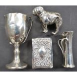 Silver maniature trophy cup (af), miniature twin handled jug (af), a silver pug pin cushion (af) and