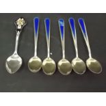 Set of five J Toscrup Norway sterling silver and a blue enamel tea spoons; together with a