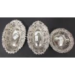 Pair of Victorian silver bonbon dishes, foliate scroll embossed with trellis piercing, Birmingham