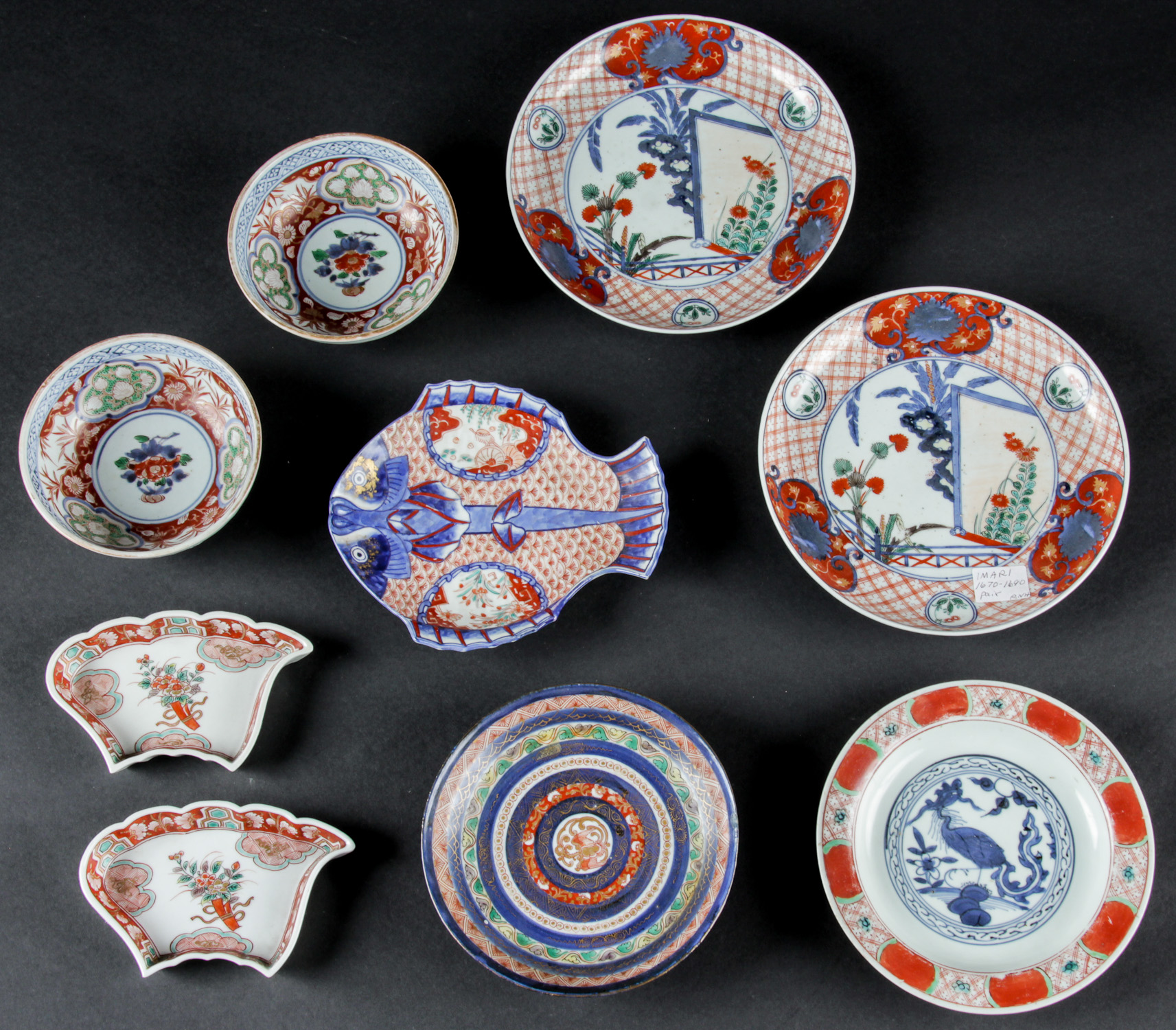 9 Antique Japanese Imari Porcelain Items. Consisting of a pair of Meiji period trapezoidal trays