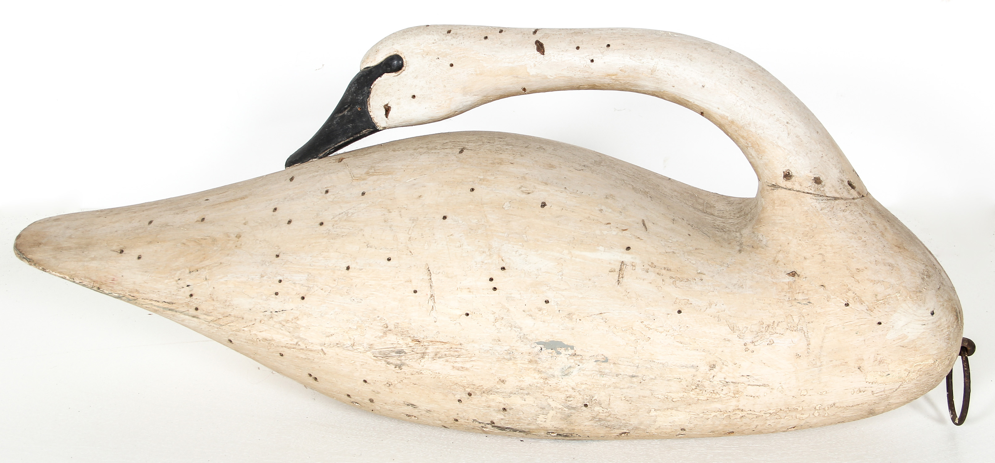 Early 20th C Preening Tundra Swan Confidence Decoy. Carved and painted timber. Size: 15" x 33" x