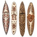 4 PNG Gope Boards. Ancestry or spirit boards. Oceania. Carved wood, pigment. Size: Longest 39" x 7.