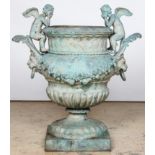 Neo Classical Urn. After the antique, a campana form festooned with cherubs, garland and lion faces.