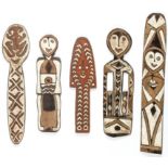 5 PNG Gope Boards. Ancestry or spirit boards. Carved wood, pigment. Oceania. Size: Longest 43.25"