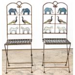 2 Folk Art Painted Folding Garden Chairs. Wrought metal frame with spring steel seats. Back splats