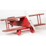 Folk Art Child's Toy Biplane Ride. Painted wood. Size: 14" x 35" x 37" (36 x 89 x 94 cm).