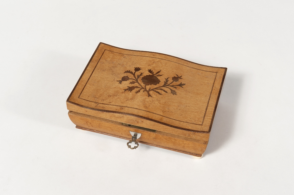 Palais Royal. Lemon tree sewing box with a shaped lid decorated with a floral pattern. It rests on
