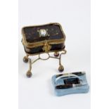 Miniature sewing table in tortoise shell on feet and in a golden metal framework. It is decorated