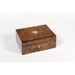 Palais Royal. Mahogany and walnut burl traveller’s necessaire with a central oval plate in mother-