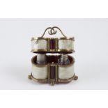 Case in the shape of two cylindrical tubes made in golden bronze and plastic imitating mother-of-