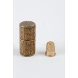 Thimble holder cup in darken wood topped by a needle and pin cushion. The body is inlaid and