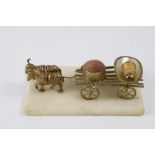 Palais Royal. A carriage of two golden metal donkeys with egg thimble holder. The ensemble is