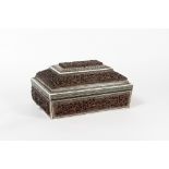 Impressive sandalwood sewing box in the shape of a sarcophagus. It is framed with stones and ivory