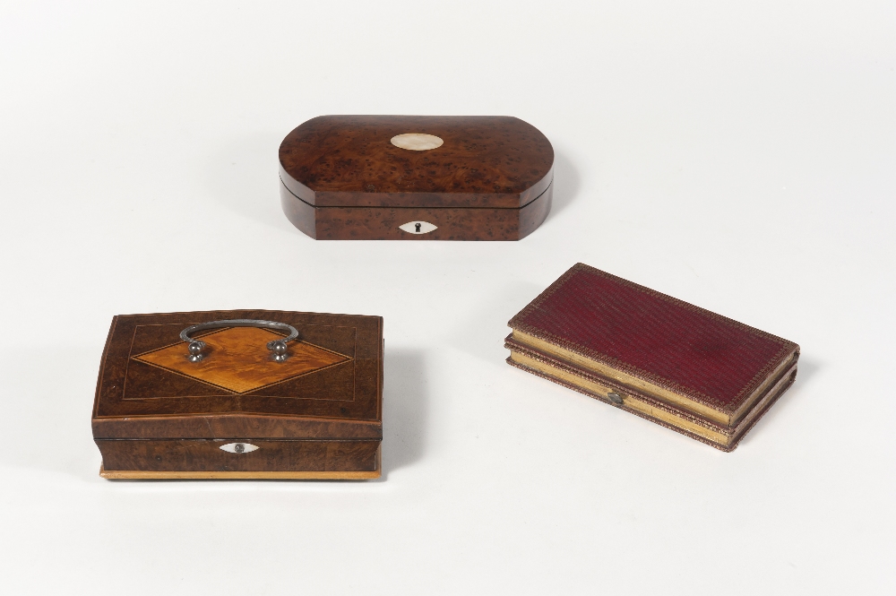 Palais Royal. Walnut burl sewing box with a curved lid decorated in its center by a mother-of-