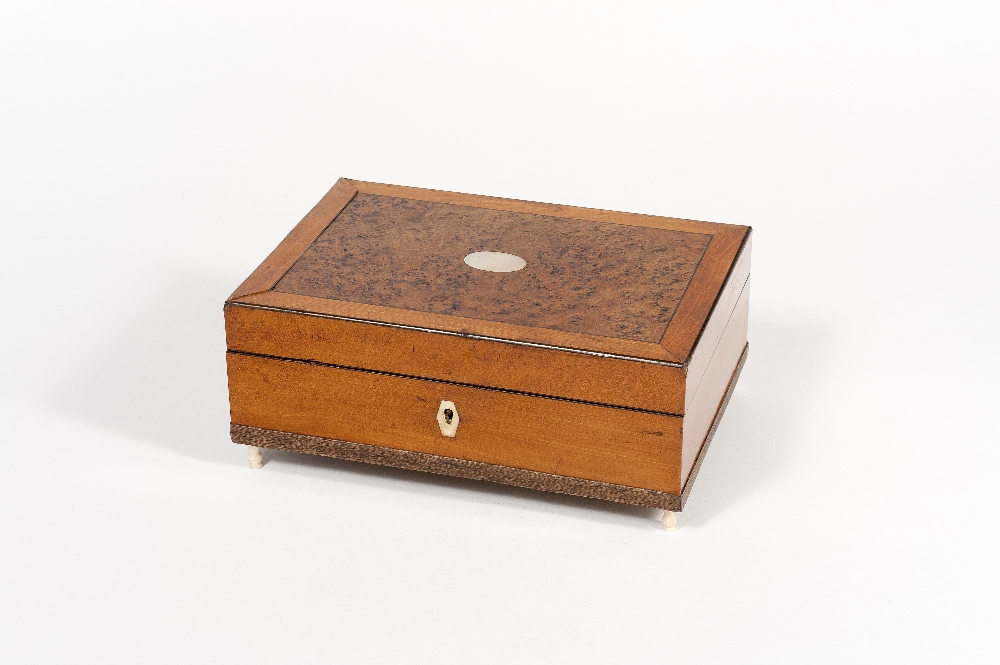 Palais Royal. Exceptional rectangular walnut burl lady traveling kit which contains 30 sewing