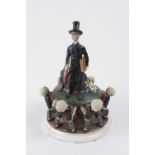 Enigmatic and humoristic porcelain statue of a character with top hat on base. He is carried by