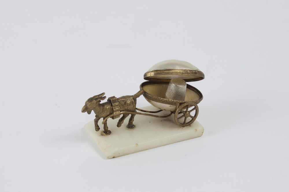 Palais Royal. Goat carriage with egg thimble holder. In golden metal and mother of pearl. On