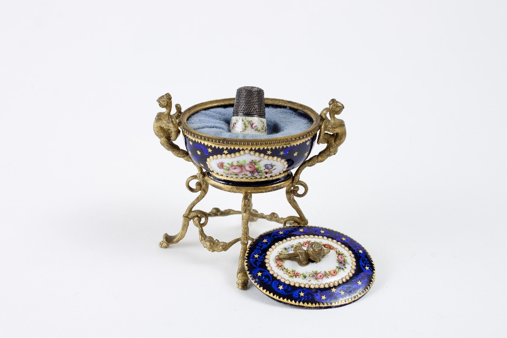 Porcelain cup converted in a thimble holder and mounted on a golden ...